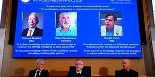 A screen displaying the winners of the 2021 Nobel Prize in Physics